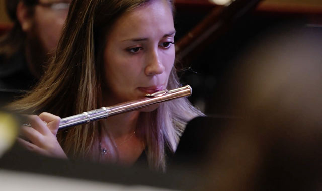 Student playing a flute