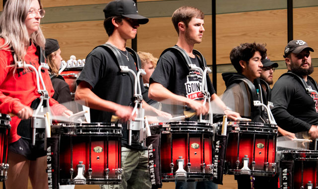 Students playing snares