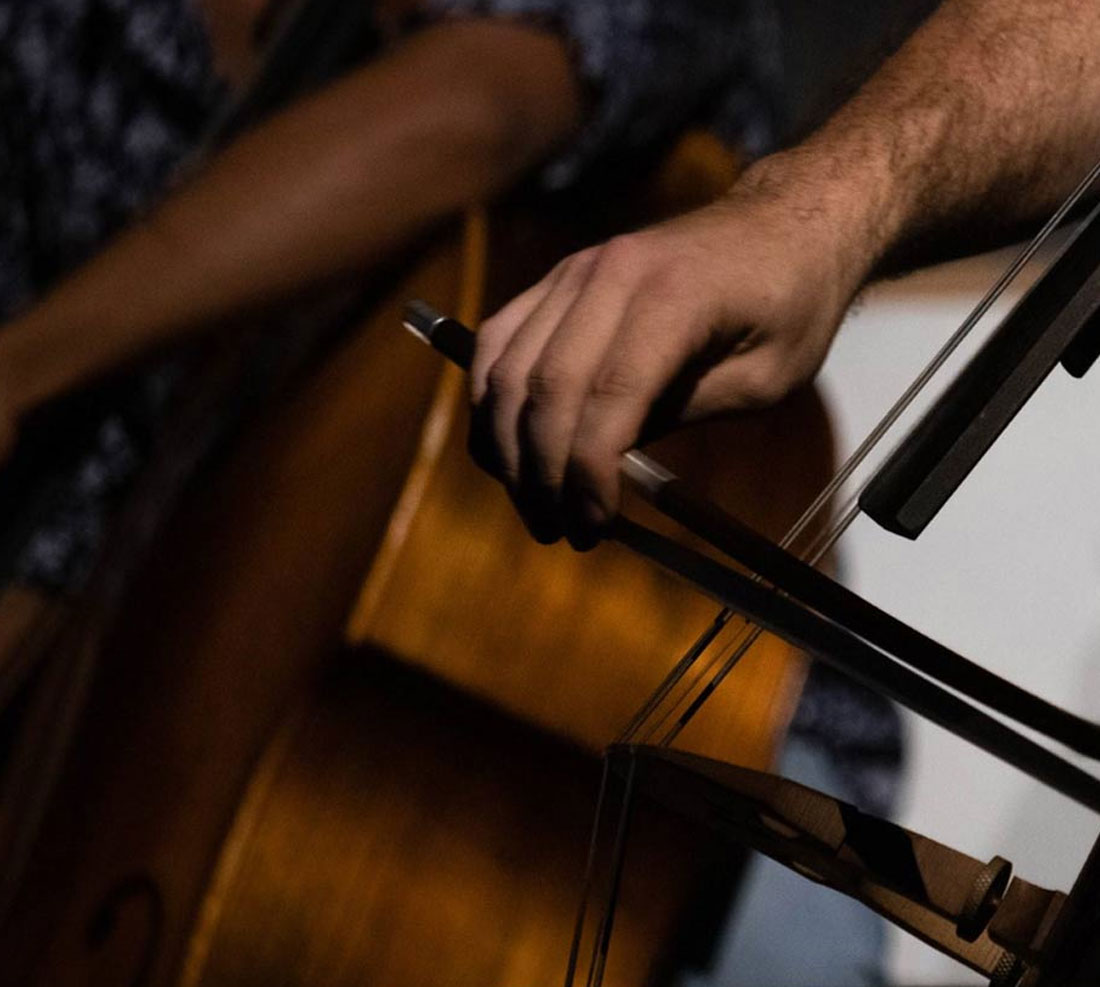 Close-up of students playing cello