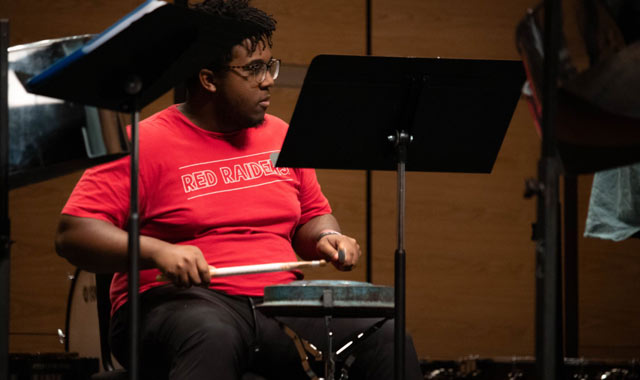 Student playing snare