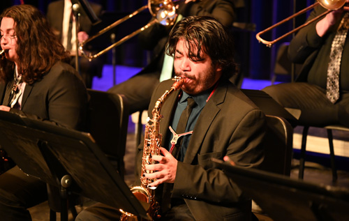 TTU student playing saxophone onstage