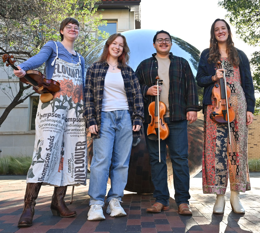TTU Vernacular Music students posing holding their instruments