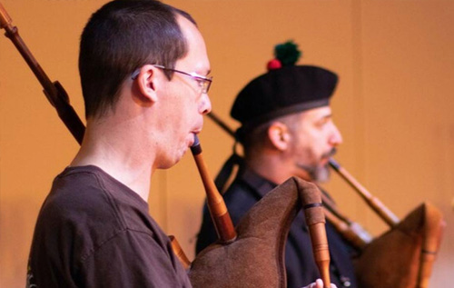 2 School of Music students playing bagpipes