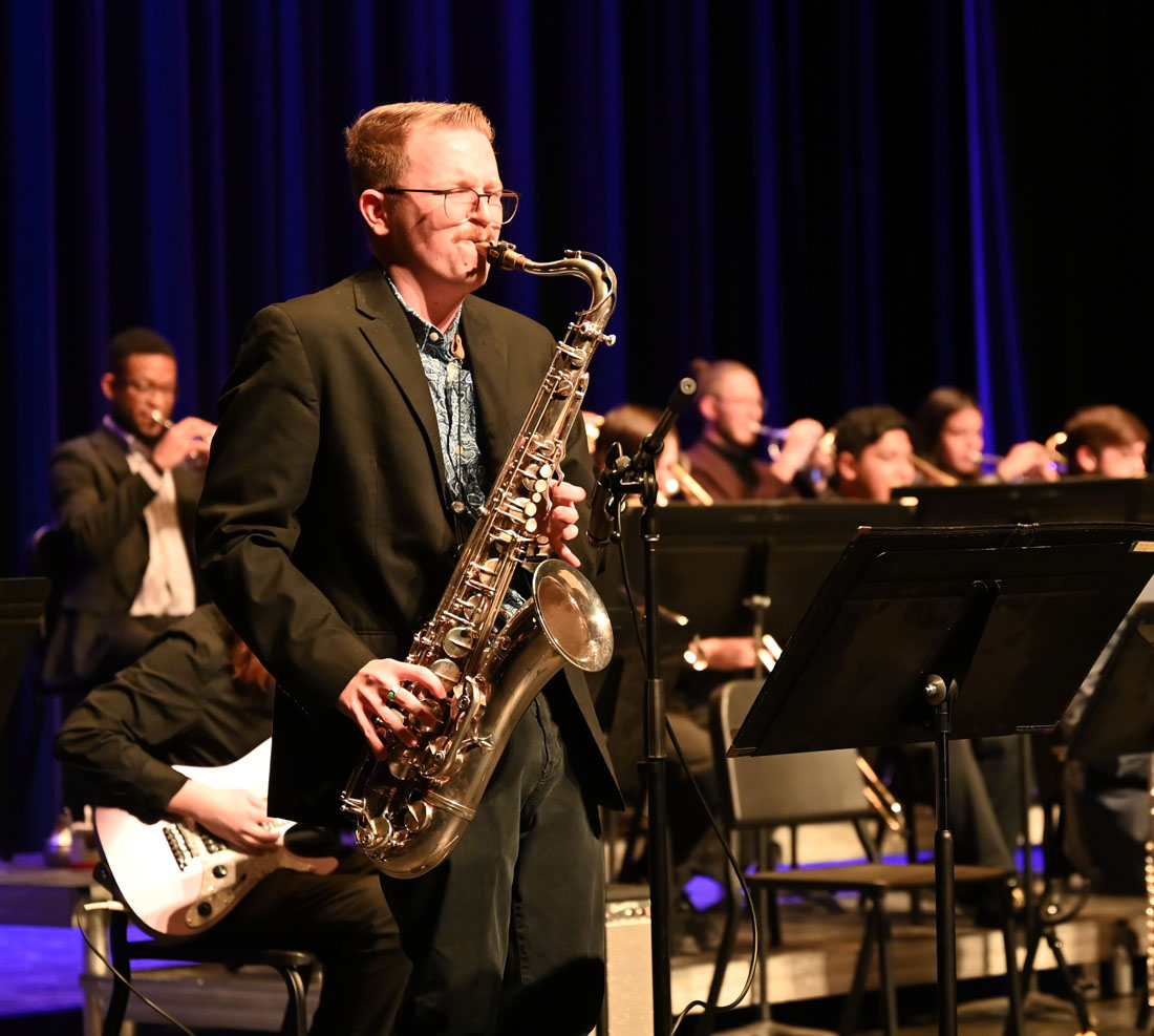 SOM Jazz Studies Student performing sax on stage