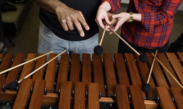 Faculty & student in front of xylophone