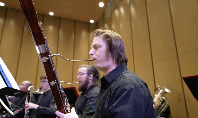 TTU student playing oboe in orchestra performance