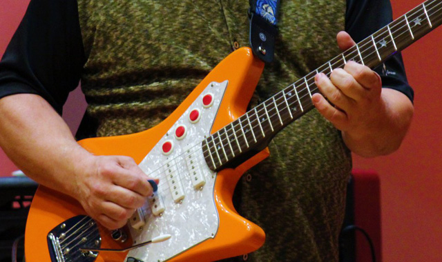 TTU Music faculty playing guitar