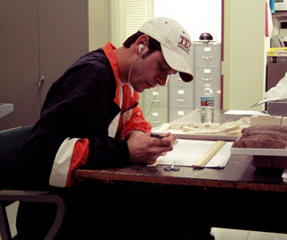 volunteer working on material