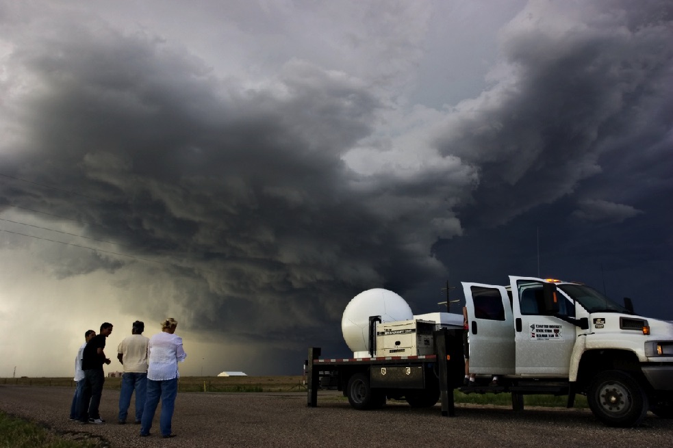 With storm clouds building in the sky, at group of TTU researchers with a ka band truck wach the storm.