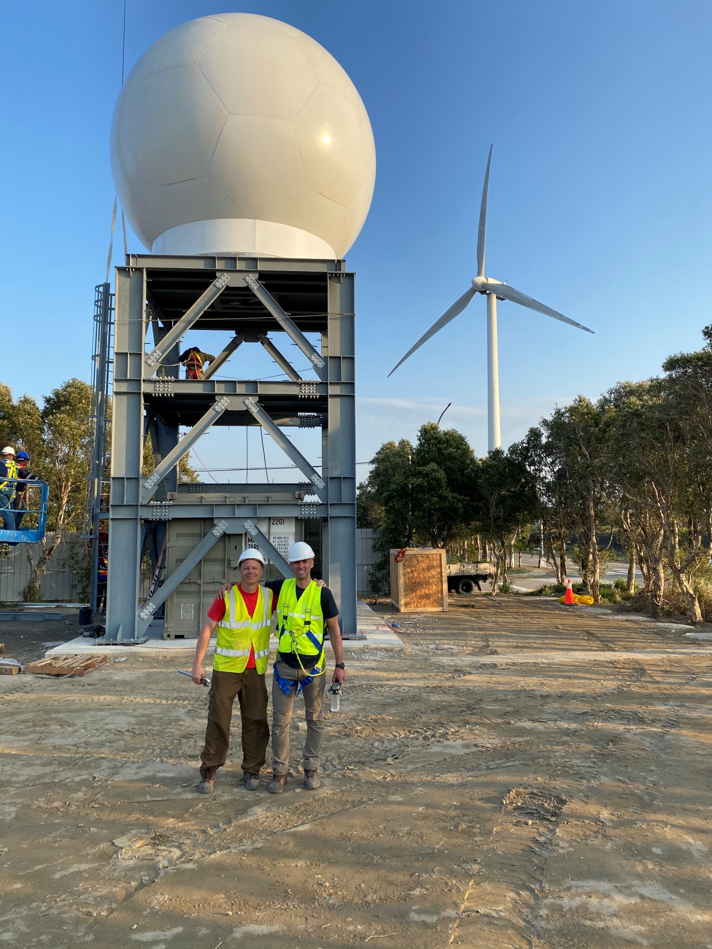 Hirth and Schroeder in front of project.