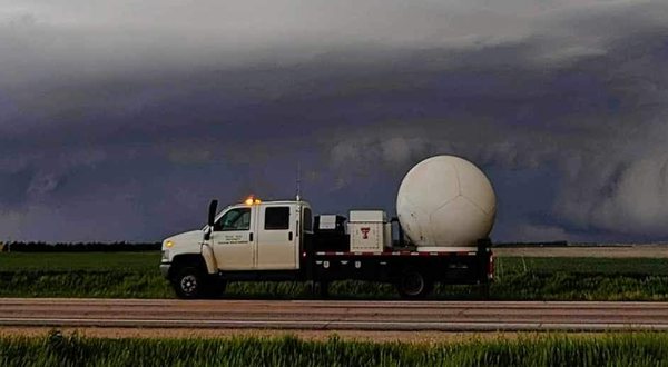 Texas Tech Ka-band mobile radar truck parked on a roadside beneath a supercell