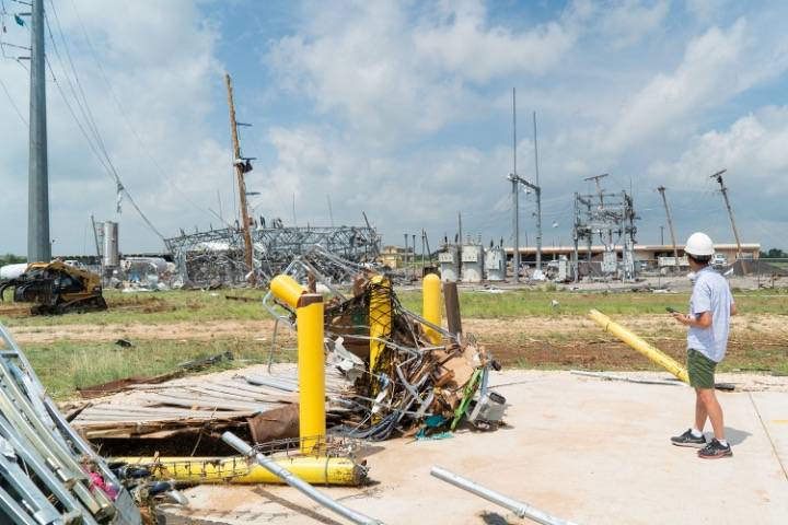 Dr. Zuo looking upon tornado damage from the Matador TX tornado.