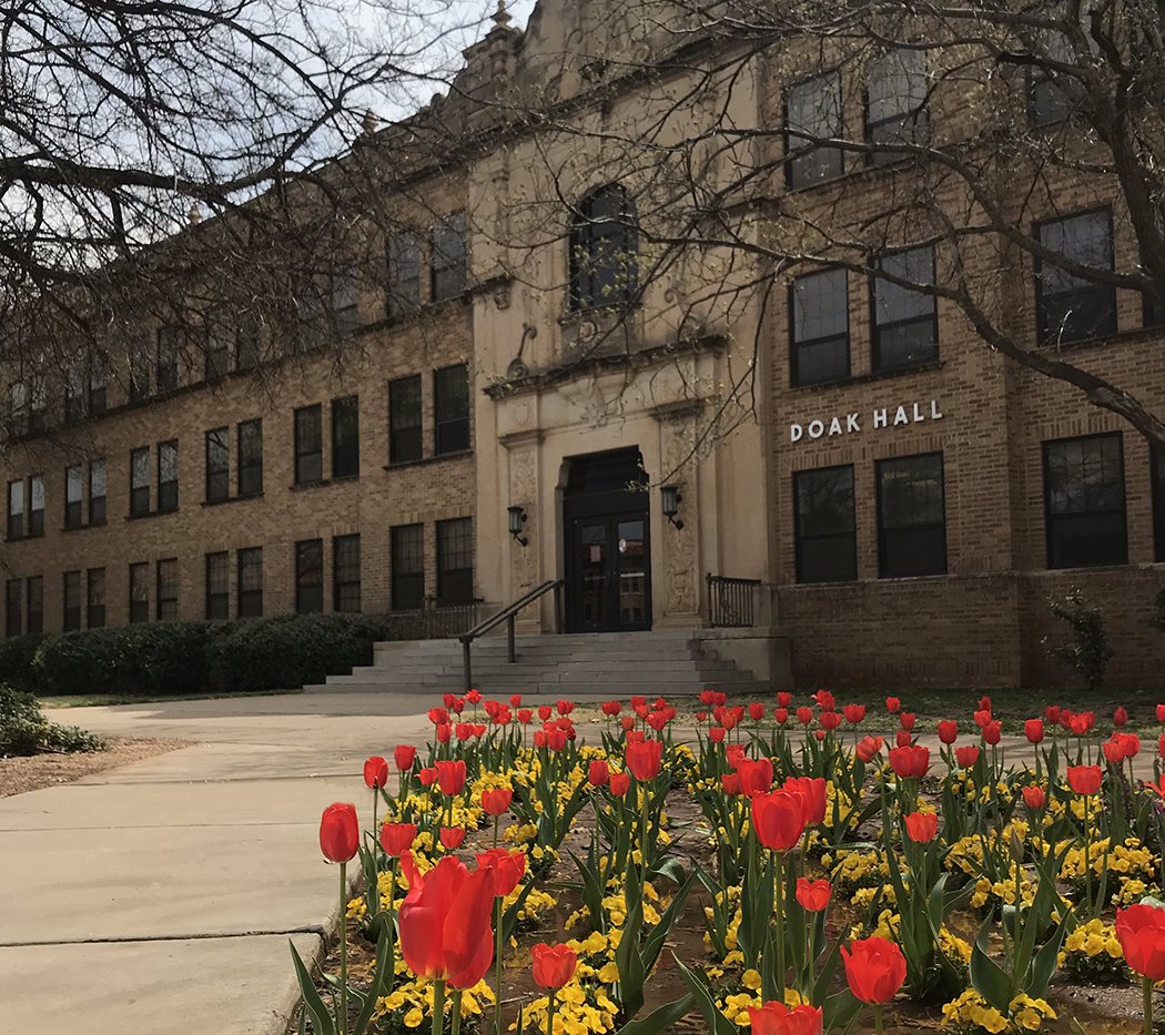 Front of the Doak building Image of the front of the Doak Building with a bed of red and yellow tulips