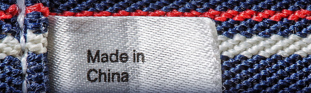 closeup of "made in China" tag on red, white and blue textile
