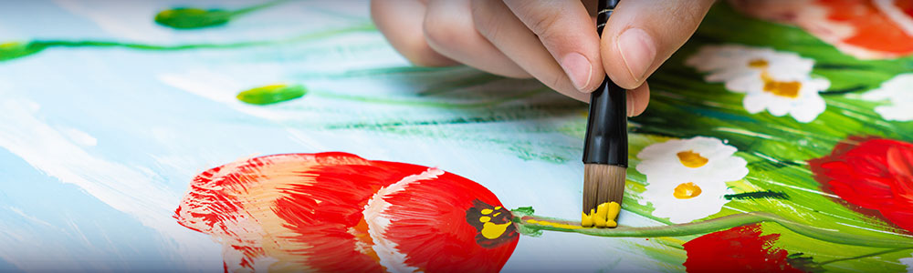 closeup of brush painting poppies and chamomiles