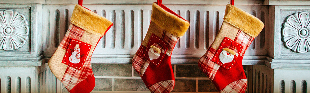 Christmas stockings hung on a fireplace