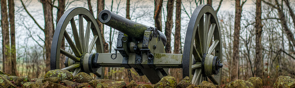  A cannon overlooking a stone fence, Gettysburg National Military Park