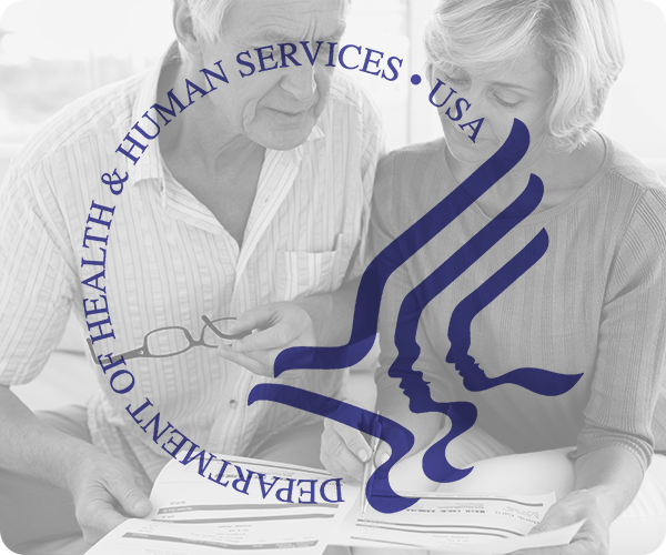 Medicare logo imposed over image of couple going over papers.