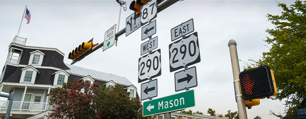  Highway signs along Main Street in Fredericksburg, Texas.