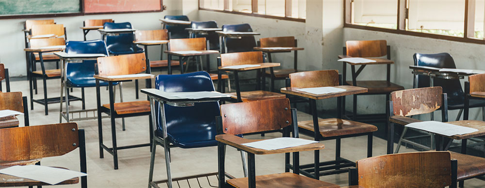  Wooden chairs in classroom.