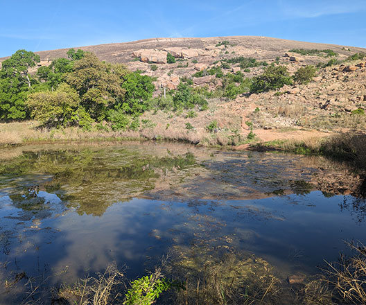 Enchanted Rock is an exfoliation dome that displays 1.2 billion-year-old granite.