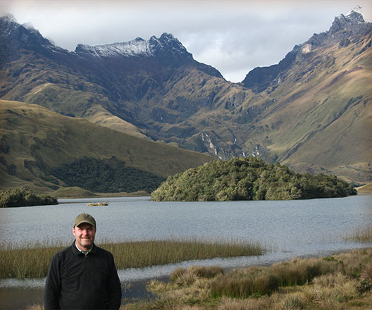 Tomas Lee in front of mountains in Ecuador
