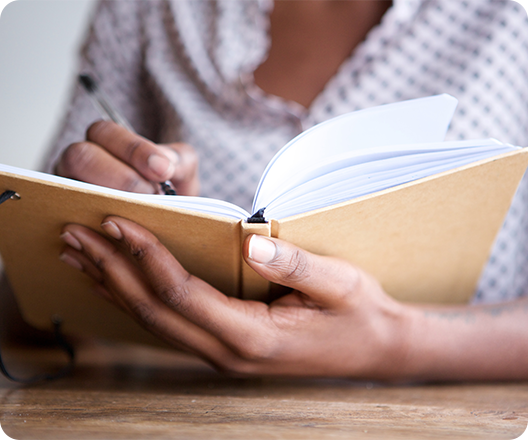 Woman writing in journal