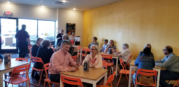 OLLI in Abilene at Cordell's Members of OLLI in Abilene sit and tables and watch Chef Jason attentively.