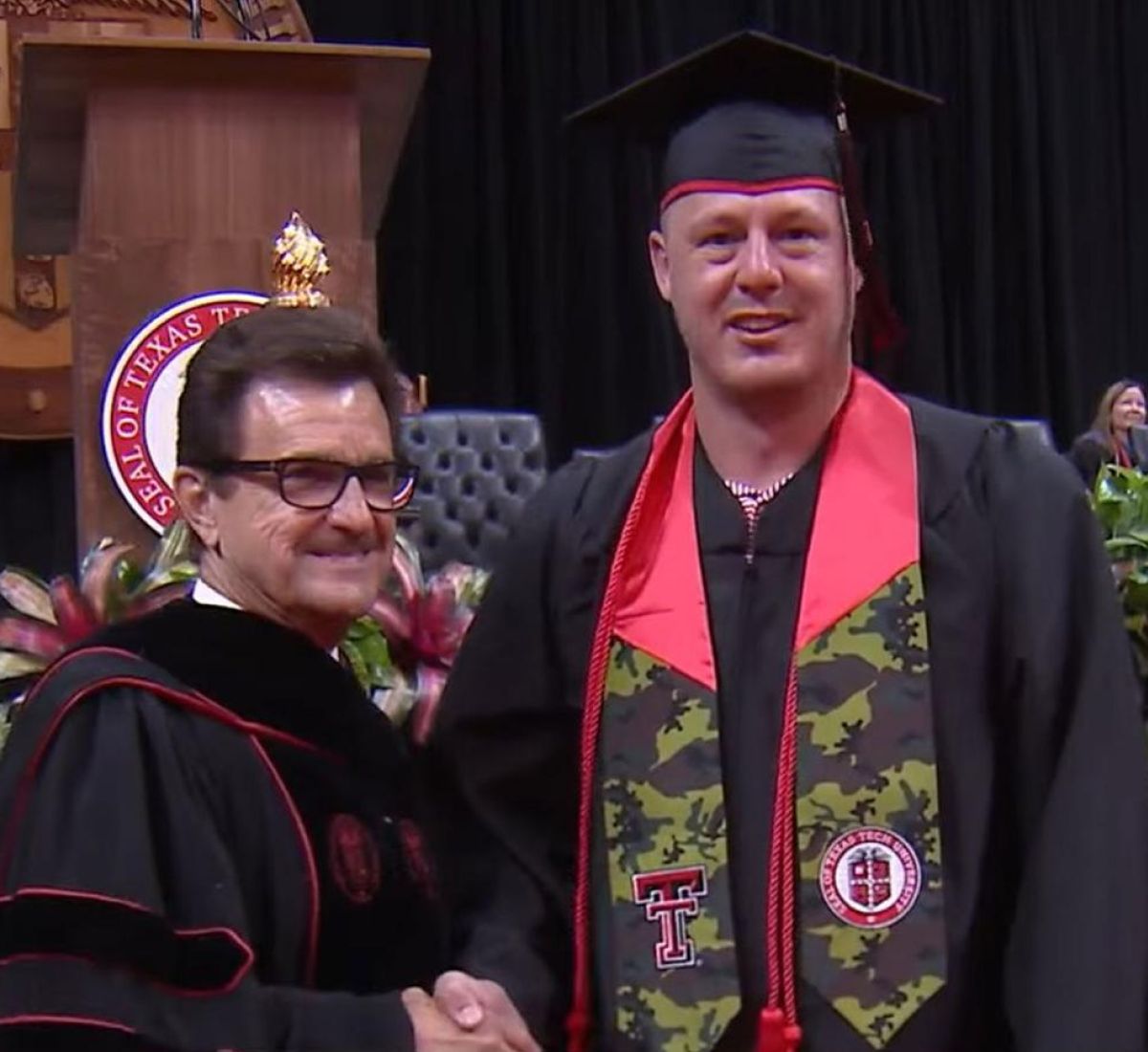 Greg Dotson shakes the hand of President Schovanec