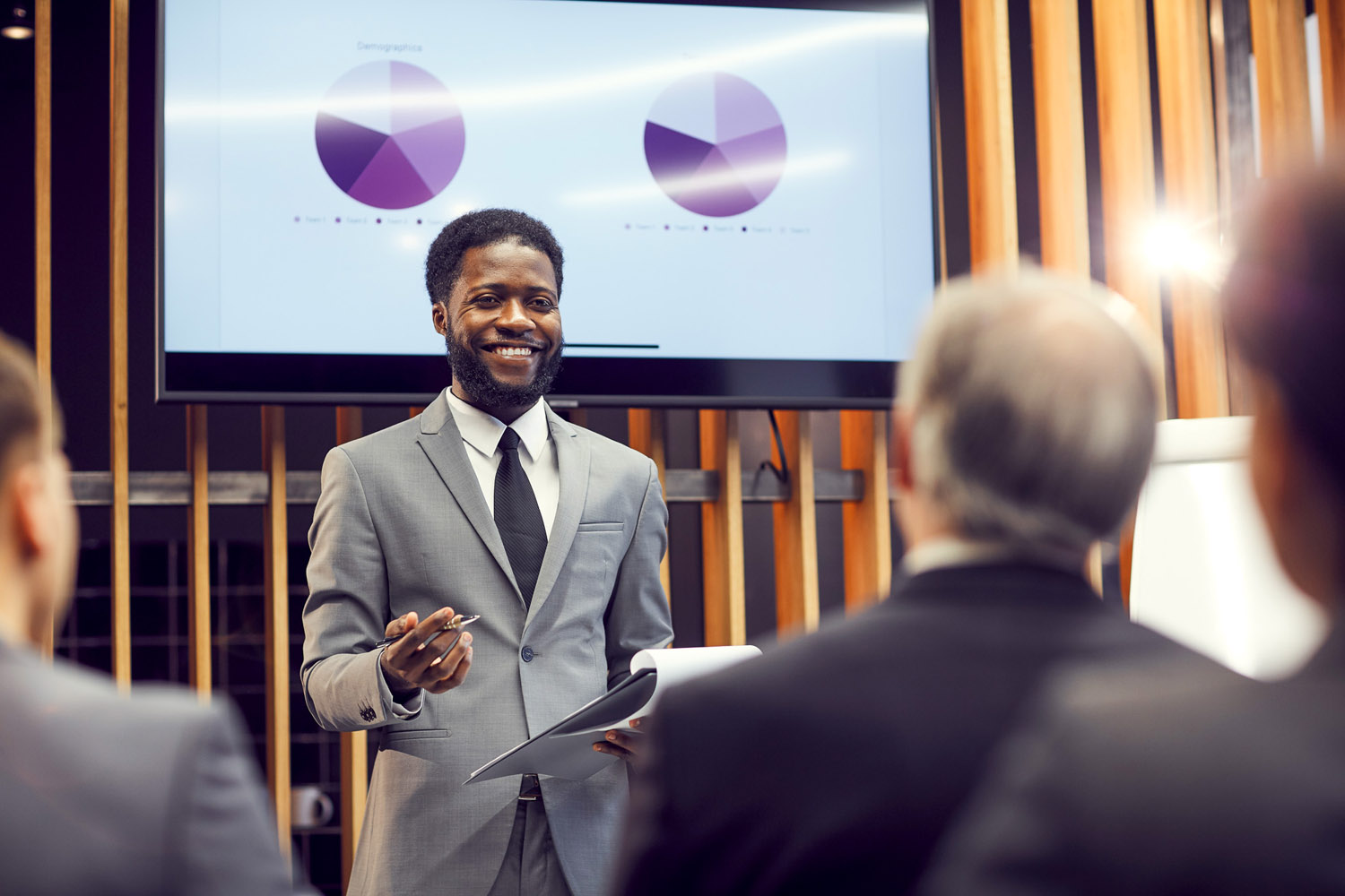 Man giving a presentation in front of audience