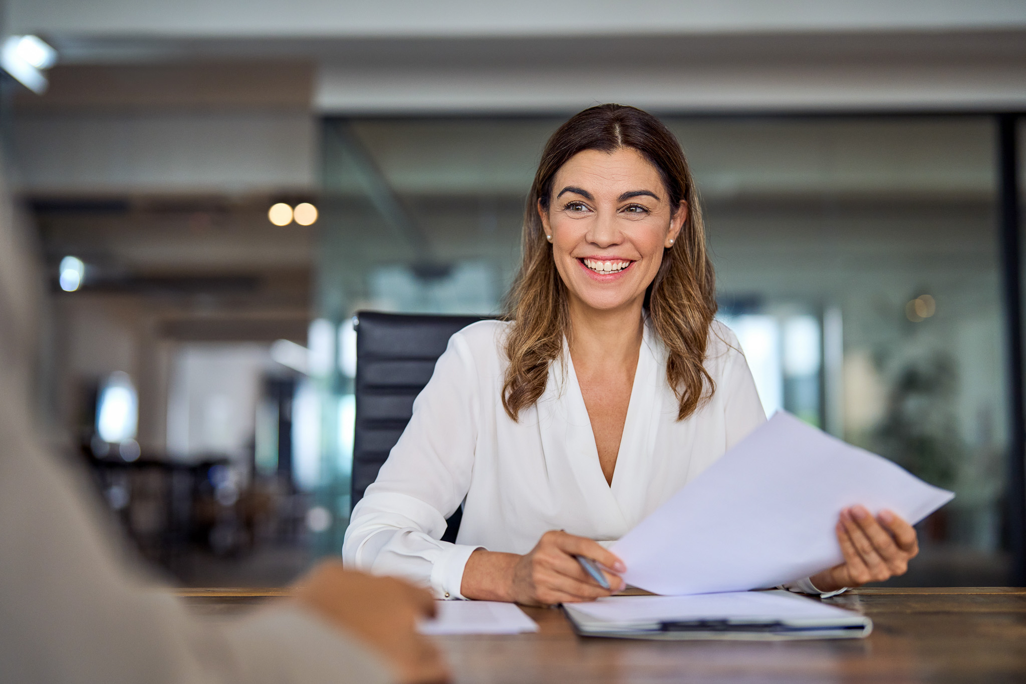 Person smiling in office chair