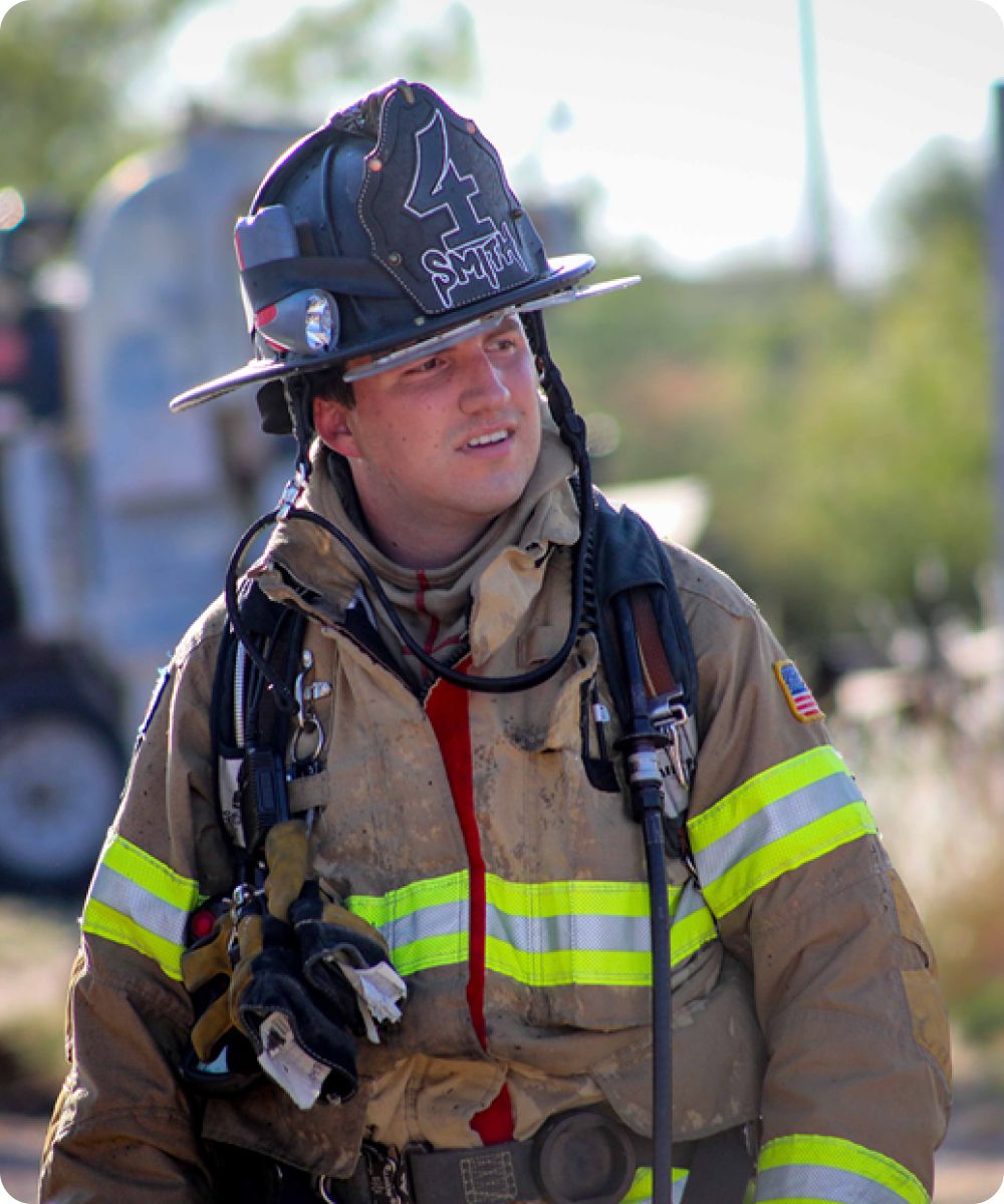 Photo of a male firefighter in protective gear.
