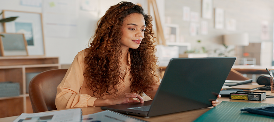 Photo of a woman on a laptop.