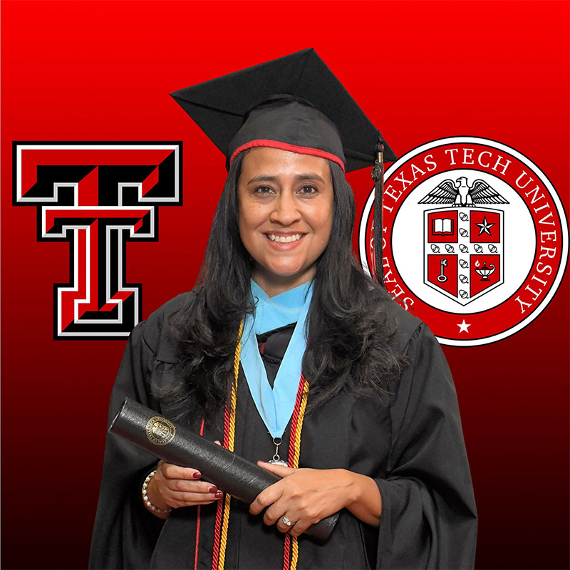 Older female student in Texas Tech master's regalia holding diploma.