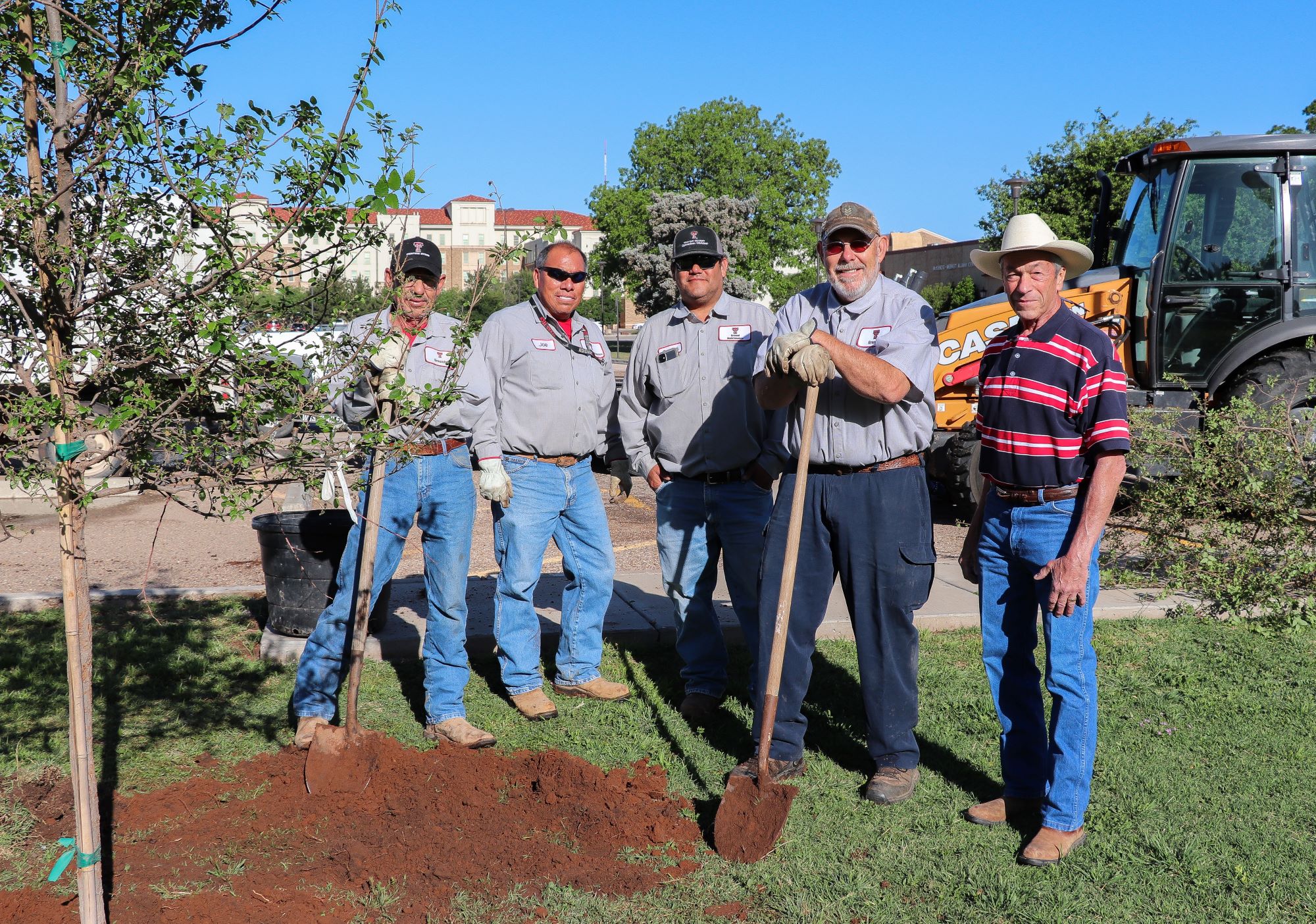 Grounds Team Planting Trees