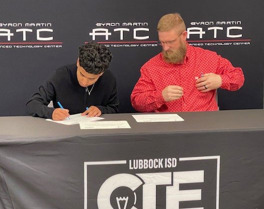 Iziah student of LISD signing to work at TTU Operations