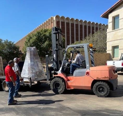 On & On Campaign preparation with a fork lift moving equipment for set up for the event