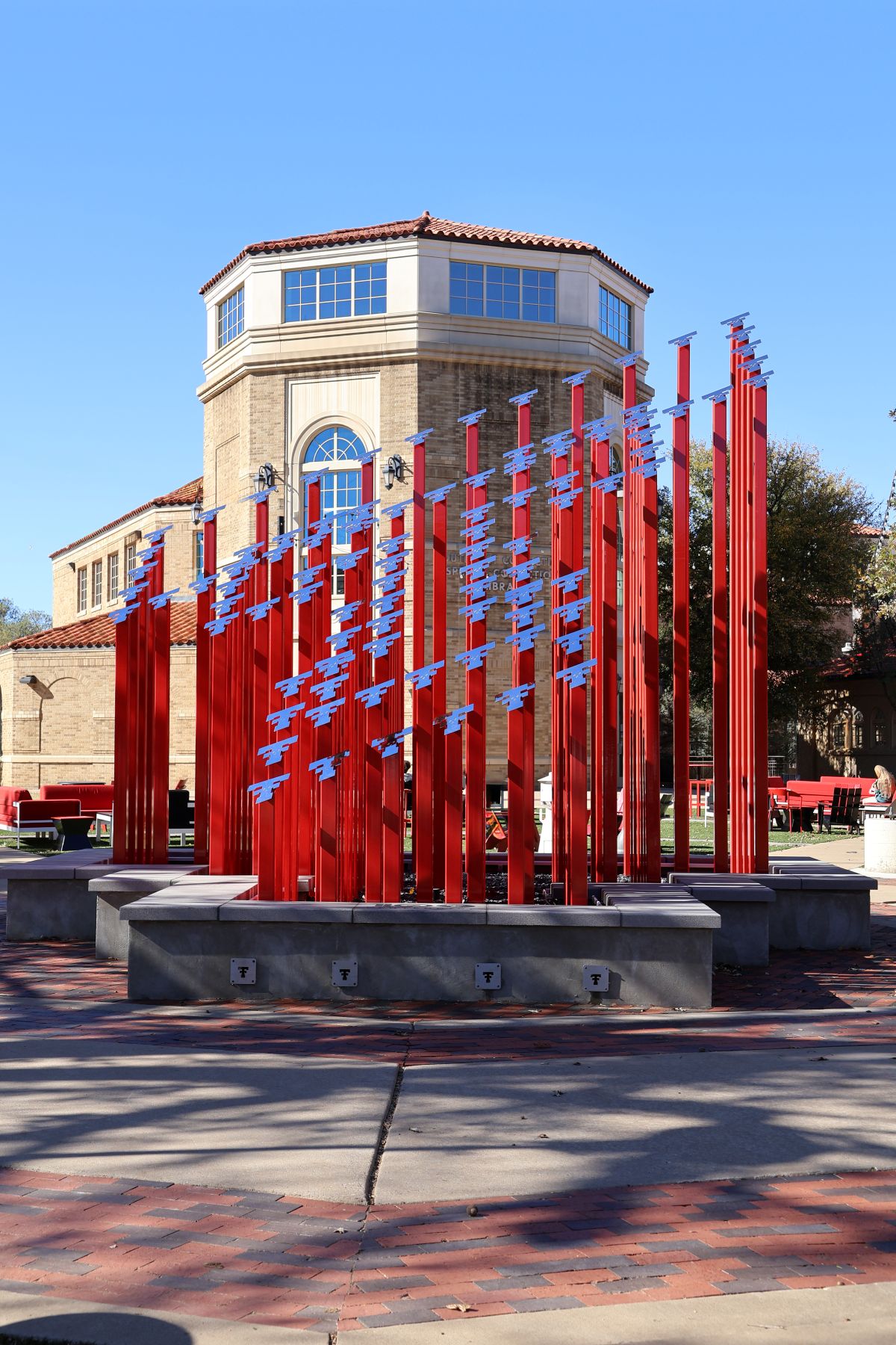 Texas Tech Centennial art piece, red tall metal with double t at the top piece creating the double t with 