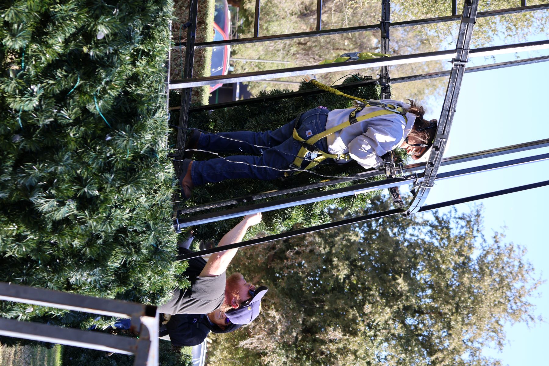 TTU Christmas Tree being assembled by two Operations employees