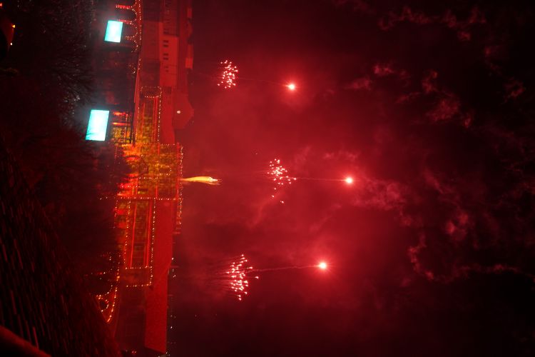 Fireworks over the Science building with the lights on the buildings