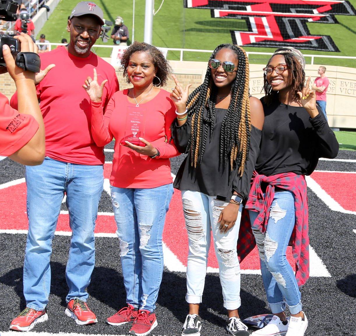 Parents of the Year awarded plaque during the Family Weekend football game