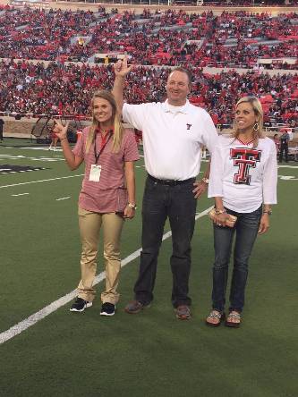 Parents of the Year awarded plaque during the Family Weekend football game