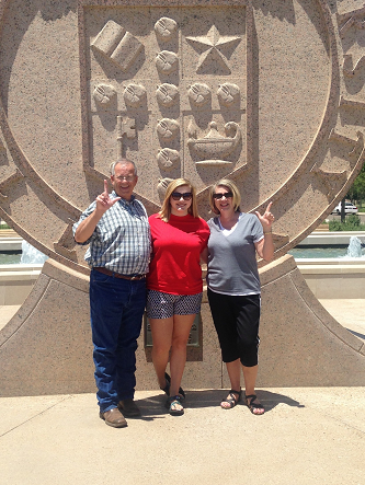 Parents of the Year awarded plaque during the Family Weekend football game