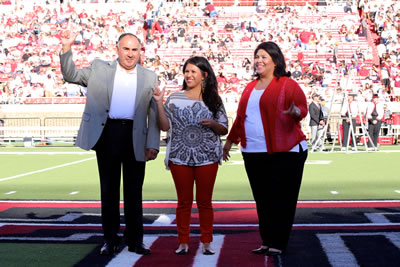 Parents of the Year awarded plaque during the Family Weekend football game