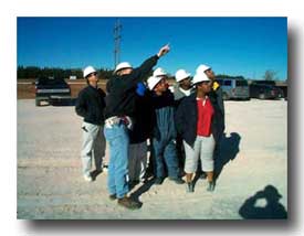 group looking at well