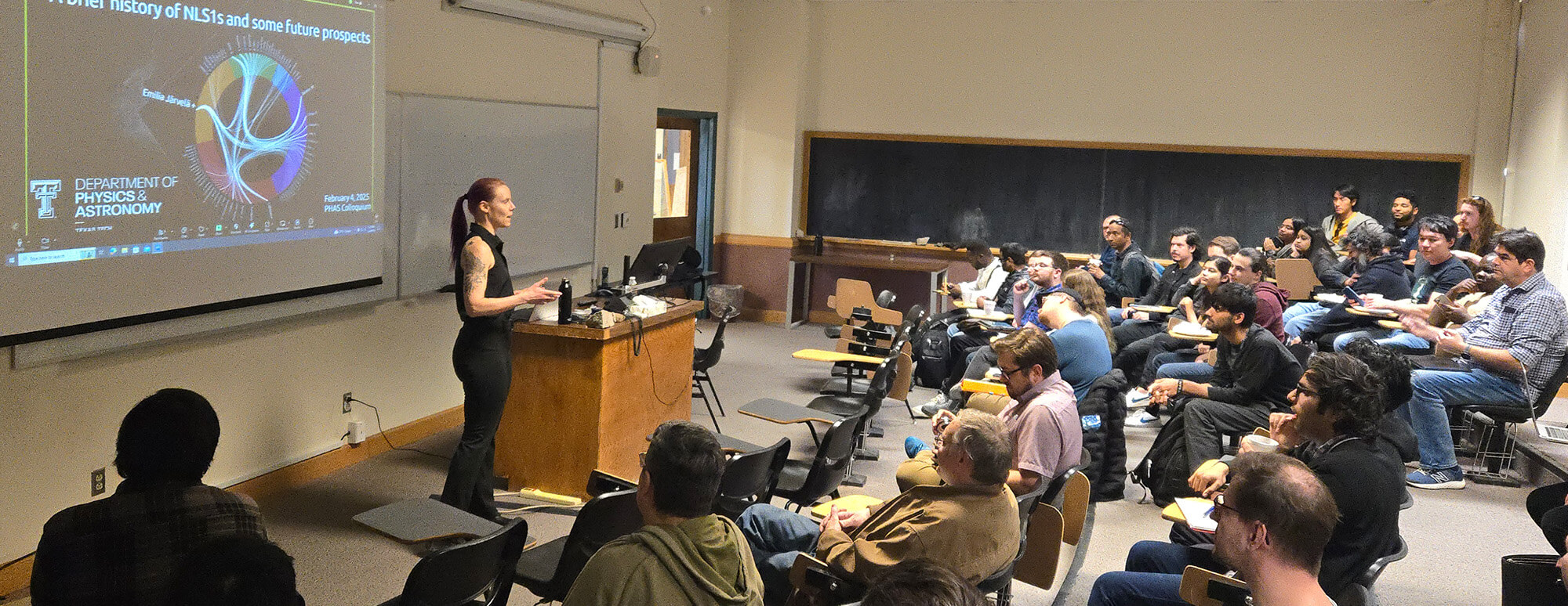 research fellows sit in a lecture room for the spring 2026 colloquium