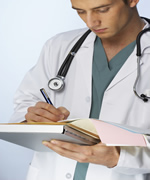 Doctor making notes on Chart