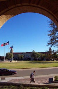 image: Memorial Circle seen through an arch at Math building