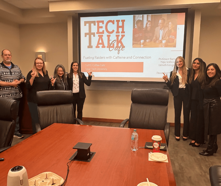 Students standing in front a proposal for the dean