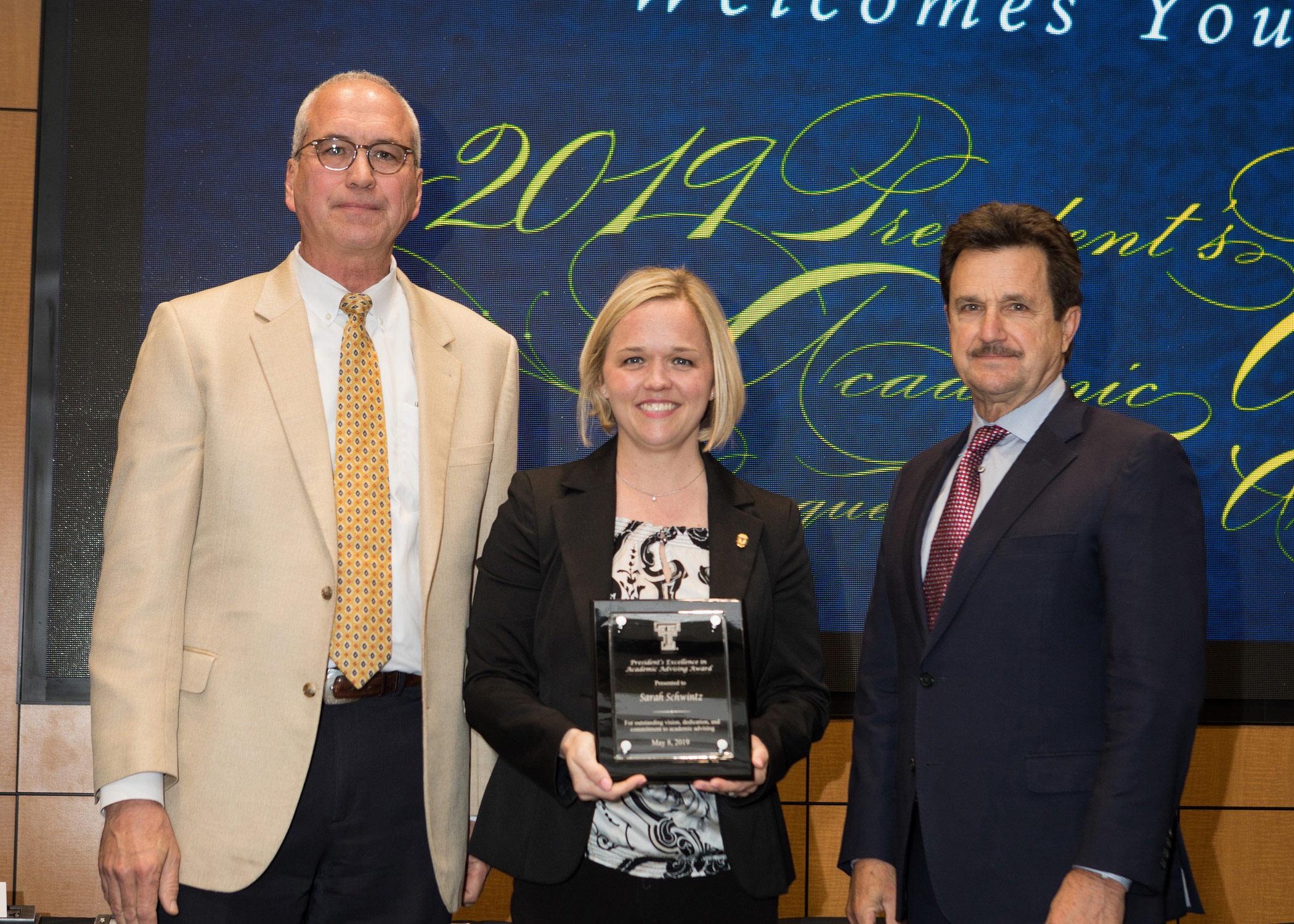 Sarah receives her award from Dr. Schovanec